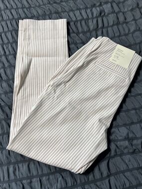 a new day cream and White Striped Skinny Pants